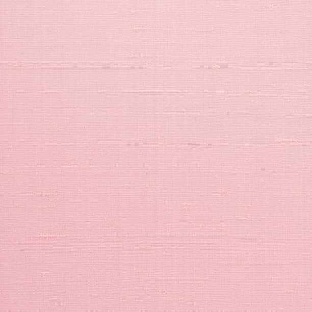 istock Woven cotton linen fabric textile textured backdrop in pastel light sweet romantic pink red color tone 1309835871