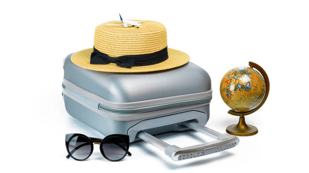 istock Summer pattern background. Suitcase, sunglasses with toy plane, straw hat and globe in travel composition isolated on white background. Design of summer vacation holiday with copy space. 1309839202