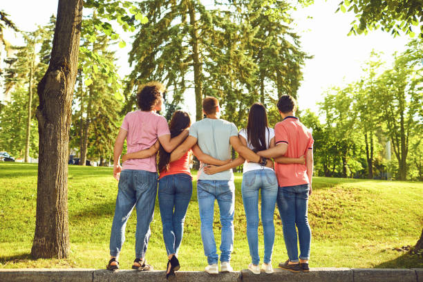 istock Young people hug in the park in nature. 1309841214