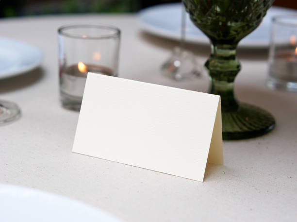 istock Mockup white blank space card, for Name place, Folded, greeting, invitation on wedding table background. with clipping path 1309844651
