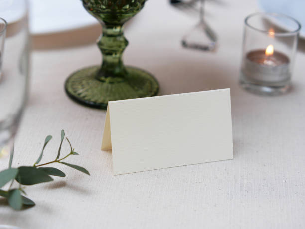 istock Mockup white blank space card, for Name place, Folded, greeting, invitation on wedding table background. with clipping path 1309844654