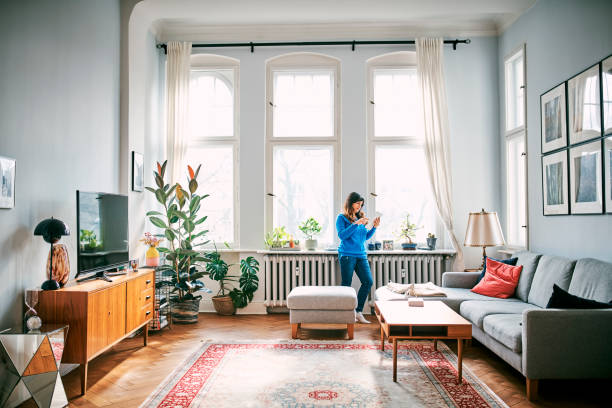 istock Woman Using Digital Tablet In Living Room 1309848541