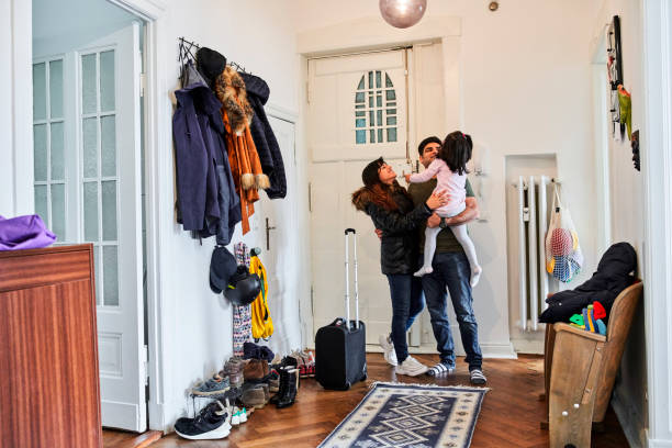 istock Family Hugging Each Other In Mudroom 1309848694