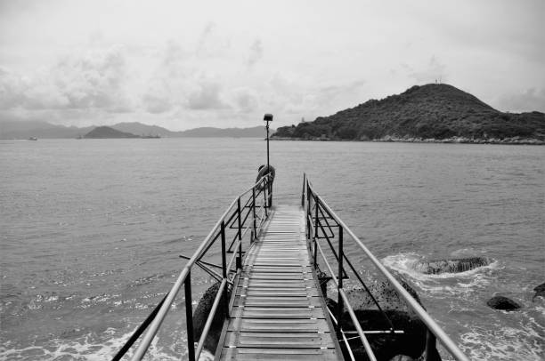 Water surrounding a traditional wooden pier