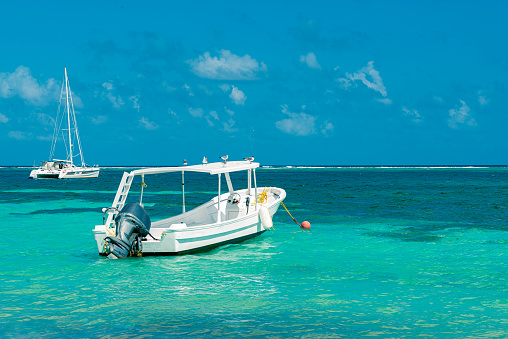 Motorized tour boat in the Puerto Morelos sea, in Mexico