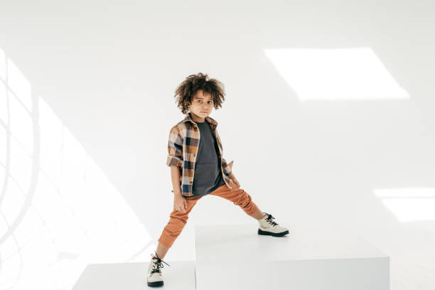 istock Standing boy with curly hair 1309850656