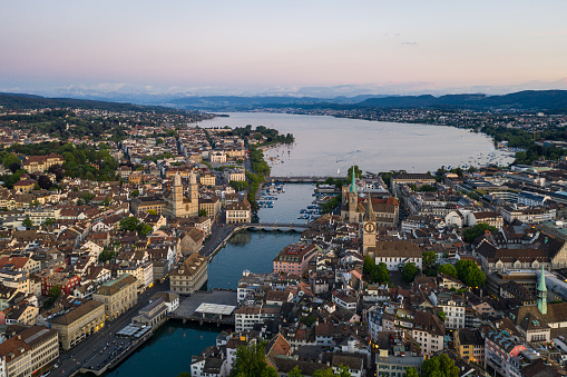 Aerial view of the twilight over Zurich old town where the Limmat river reaches lake Zurich in Switzerland largest city.