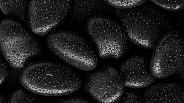 istock Black Stones.rock background and water drop 1309859681