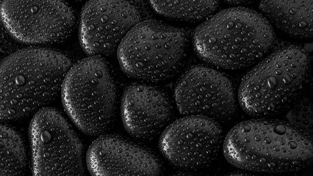 istock Black Stones.rock background and water drop 1309859698