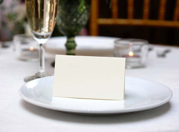 istock Mockup white blank space card, for Name place, Folded, greeting, invitation on wedding table background. with clipping path 1309862059