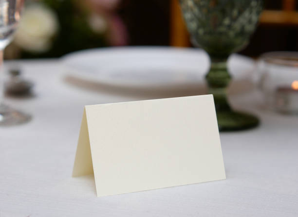 istock Mockup white blank space card, for Name place, Folded, greeting, invitation on wedding table background. with clipping path 1309862066