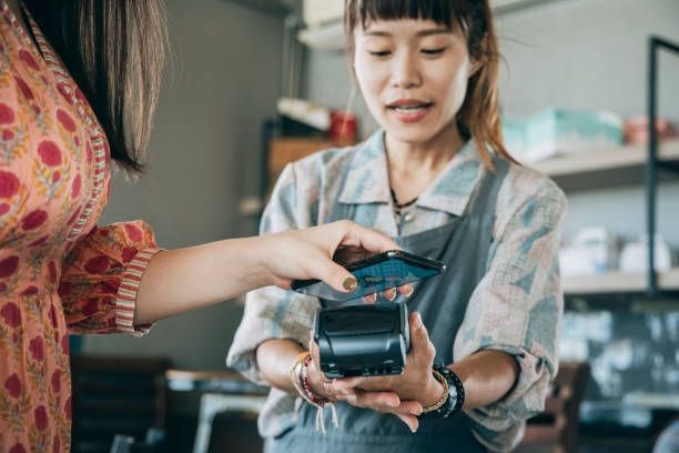 Contactless payment Contactless payment asian cashier stock pictures, royalty-free photos & images