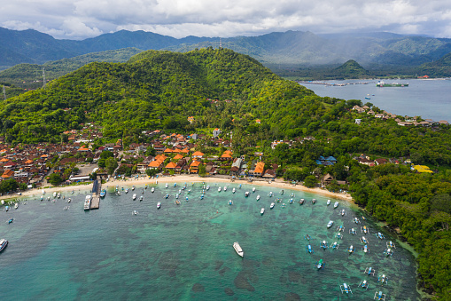 Aerial viewf of the idyllic Padangbai village, beach and town in eastern Bali, Indonesia