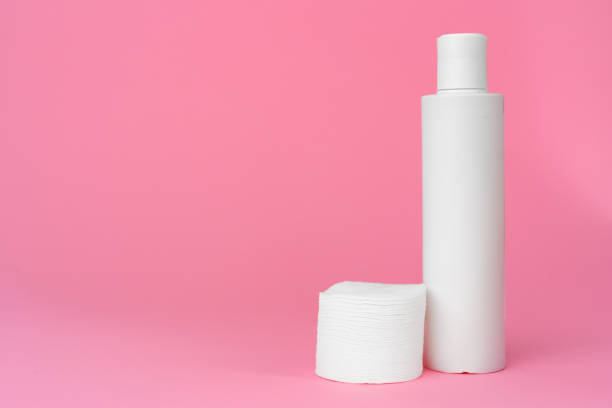istock Stack of cotton discs and skicare cosmetic bottle 1309867848