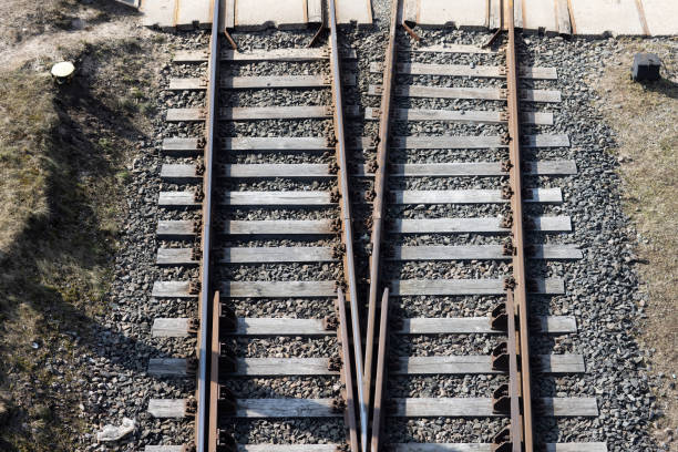 Rusty railroad tracks on gravel. Top view of railways on a sunny day