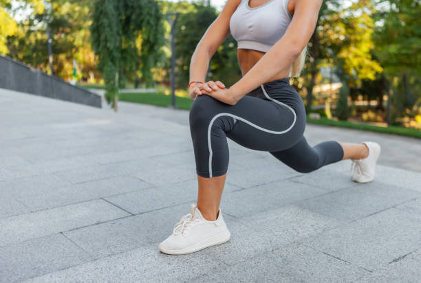 istock Woman practicing leg stretching before outdoor workout 1309870161