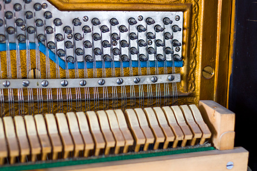 Piano instrument inside, antiquary piano and old mechanism, close-up