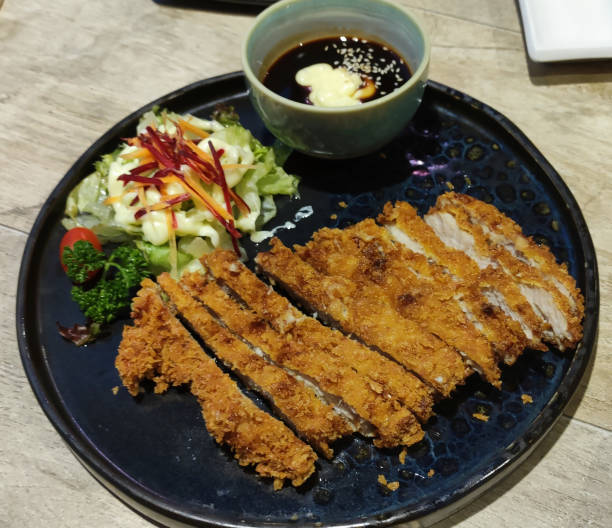 istock Tonkatsu is a Japanese-style deep-fried pork cutlet. 1309872009