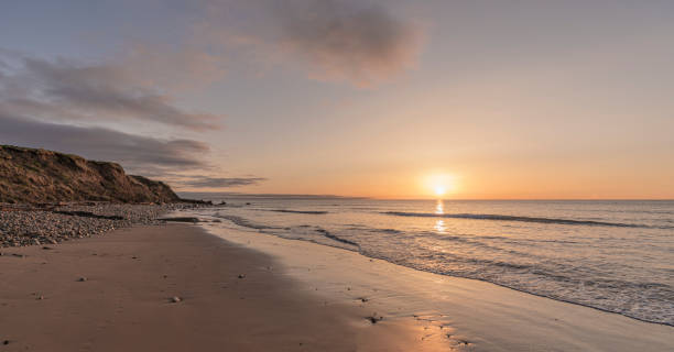 istock Sunrise at Whitburn beach 30th March 2020 1309875533