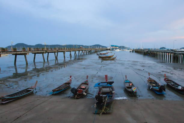 istock Fisherman wood boat parking at Phuket Thaland. 1309877806