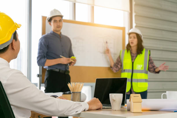 istock Group of diversity people engineer meeting or discussing work in office or construction. Engineering business concept. 1309878962