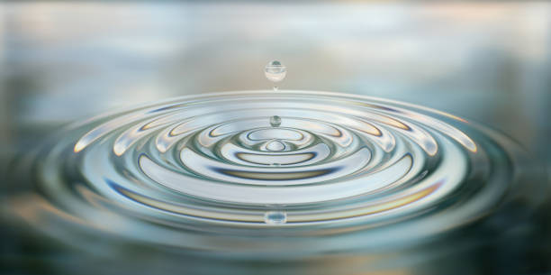 istock Water drop splash close-up on water surface 3d illustration 1309879490