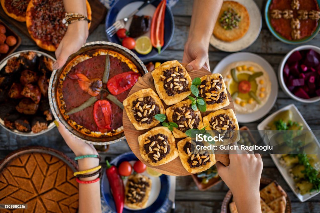 Breaking Fasting time at the ramadan month. Prepared table for iftar Many traditional foods on the table. Eid-Ul-Fitr Stock Photo