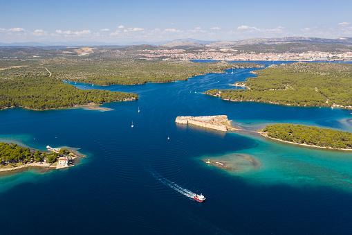 Stunning aerial view of the St. Nicholas Fortress at the entrance of the St. Anthony Channel leading to the Sibenik city in Croatia on a sunny summer day