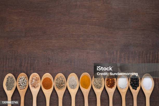 Various Spices In Wooden Spoon On Wood Table Background Sugar Pepper Salt Turmeric Rosemary Oregano Copy Space Stock Photo - Download Image Now