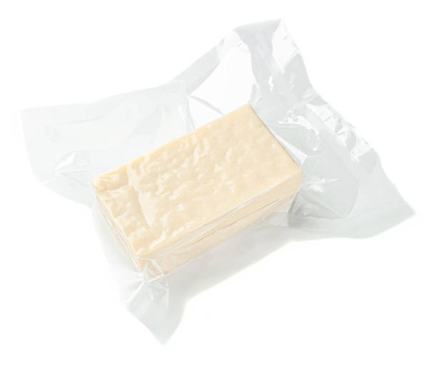 istock A piece of rectangular cheese in a vacuum package. View from above. White background. Isolated. 1309883014