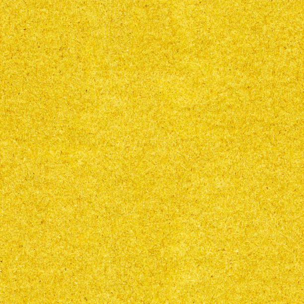 bezszwowy jednolity połyskujący złoty wzór w wektorze - abstrakcyjna płaska ilustracja z pięknym surowym szorstkim efektem tekstury plamistej - gęsto tkana tkanina z bliska - żółty papier ścierny - leather textured backgrounds textile stock illustrations