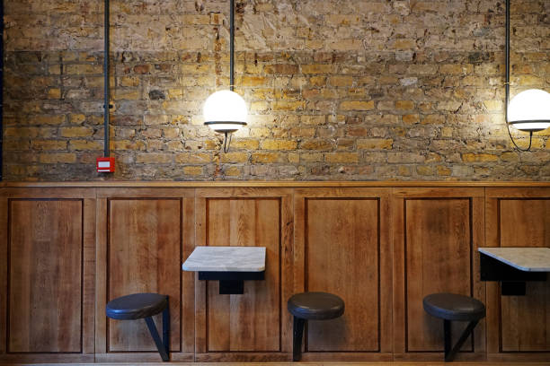 decorated with wooden furniture and panels with brick wall