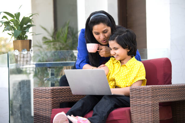 istock Mother and daughter using laptop 1309884146