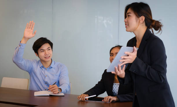 istock Businessman asking questions to the speaker during the briefing. Man Has Question During Presentation. 1309885657