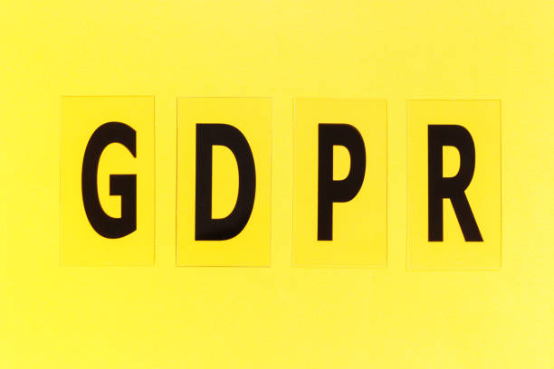 istock Inscription GDPR on yellow background close-up, top view. 1309885843