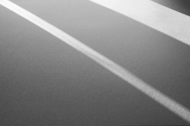 istock Shadows and abstract lines on paper surface as texture or background 1309886073