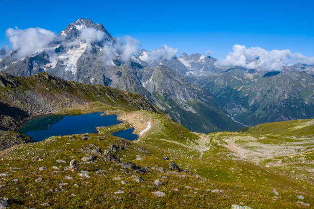istock mountain landscape, small blue lake in a bowl 1309886280