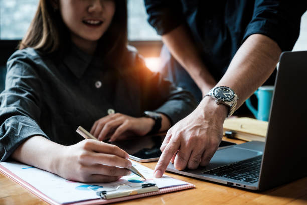istock Analytics intelligence concept. Group of business people discuss current financial and economic paperwork for investment at the meeting. 1309887465
