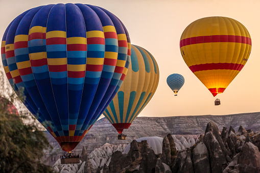 Colorful hot air balloons flying over Cappadocia in the morning