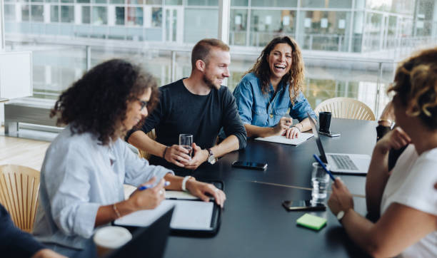 istock Business people smiling after a productive meeting 1309889248