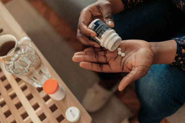 I have the worst pain ever Close Up African American Woman Taking Out Pills From Bottle, Supplements or Antibiotic, Female Preparing to Take Emergency Medicine, Chronic Disease, Healthcare and Treatment Concept aspirin photos stock pictures, royalty-free photos & images