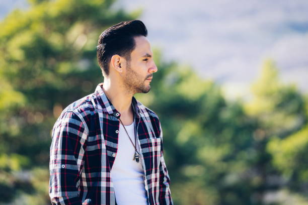 istock Profile of attractive man in the field 1309890126
