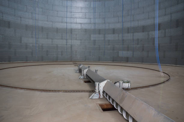 istock Grain storage silo inside view. Silo bottom. Storage of bulk food products. 1309890881