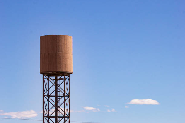 Large white water tank with blue sky