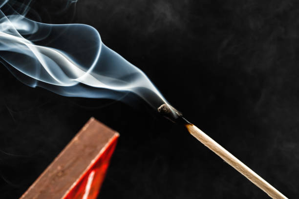 istock extinguished match with smoke on blak background 1309891866