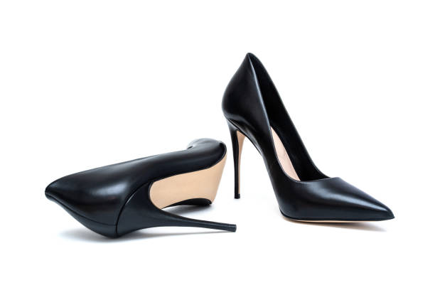 istock Black female high heel shoes isolated on white 1309892995