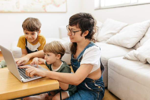 istock Young family using laptop at home 1309893010