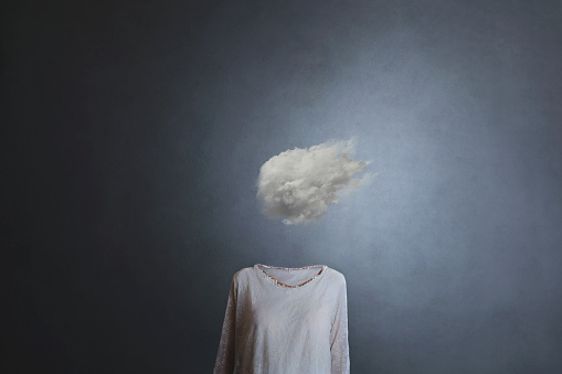 woman's head replaced by a white cloud