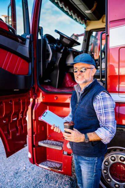 istock Mature truck driver with clipboard 1309894202