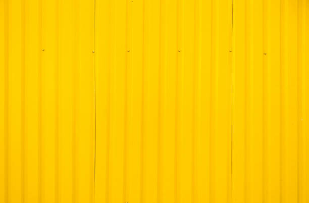 Yellow metal tile fence background.